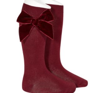 Knee high sock by Condor with velvet bow.