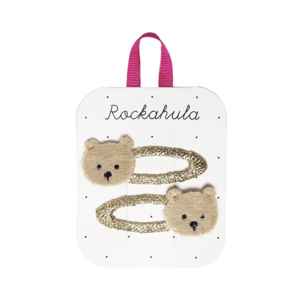 This pair of super soft teddy bear clips are made from the softest brown fur. With the cutest little face and glittery ears they are are the perfect accessory for any bear lover! Each bear is set on a snap clip wrapped in pink grosgrain ribbon.
