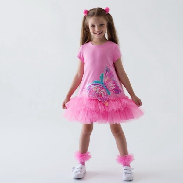 Daga - Pink Paradise 2025 Summer Collection - Gorgeous dress loose fitting jersey dress with soft tulle double ruffle hem. Soft stretchy jersey dress with cap sleeves and double ruffle hem in soft fucsia pink tulle with a large applique butterfly on the front. single button at the back of the neck. This is an ICONIC Daga dress - a must have for every season. Loose fitting and easy to fit and wear.