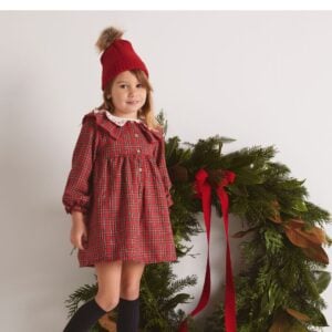A lovely red tartan dress for girls by Babidu, woven in soft cotton. This classic style has a pretty ruffle collar with red embroidered detailing and long sleeves with elasticated frilly cuffs. Lined for comfort, it fastens neatly on the front with buttons.