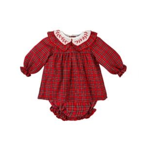 A delightful red tartan dress for baby girls by Babidu, woven in soft cotton. This sweet, traditional style has a pretty ruffle collar with red embroidered detailing and long sleeves with elasticated frilly cuffs. It fastens with buttons on the back and comes with a pair of matching knickers.