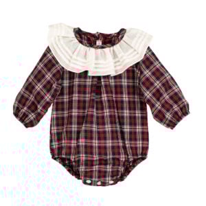There’s something undeniably nostalgic about this piece from Calamaro – like something you'd spot in an old photograph, worn by a baby sitting wide-eyed by the tree. Made from soft, super lightweight tartan cotton in festive shades of navy, red and white, this unisex romper is topped with a showstopping pleated white collar for a classic Christmas finish. The gently elasticated cuffs and legs keep your little one comfortable all day long, while pearlised buttons down the back and crutch make changes a breeze. Pair with tights or knee socks and a cardigan to complete the look.